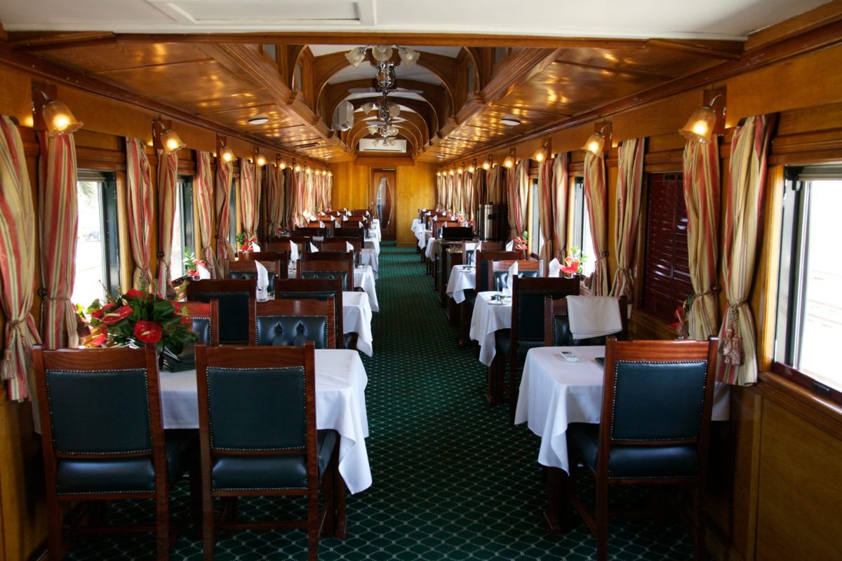 One of the dining cars in the Rovos Rail Pride of Africa all set up to serve lunch.