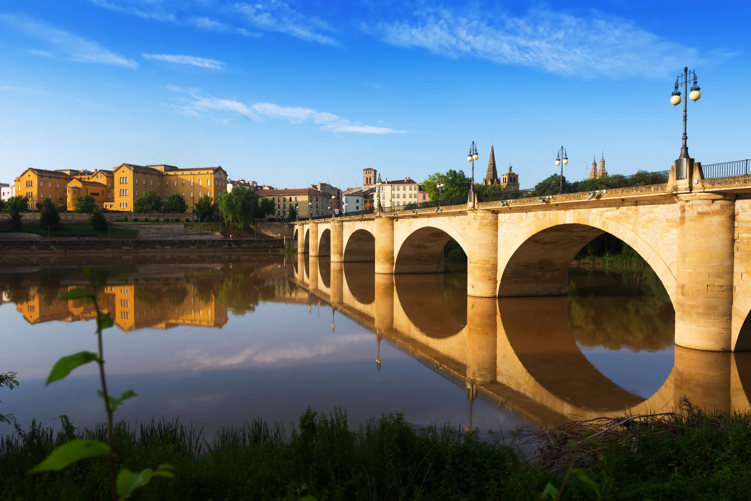 Day view of ancient bridge over Ebro river. Logrono, Spain